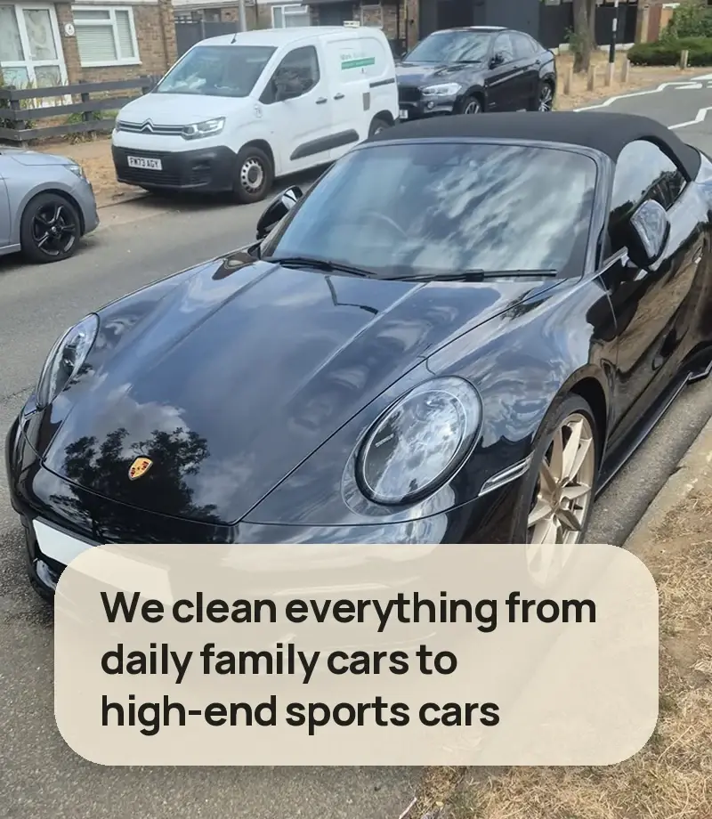 We clean everything from daily family cars to high-end sports cars - black Porsche 911 cabriolet on a residential street